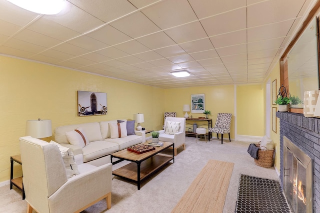 carpeted living room featuring a brick fireplace