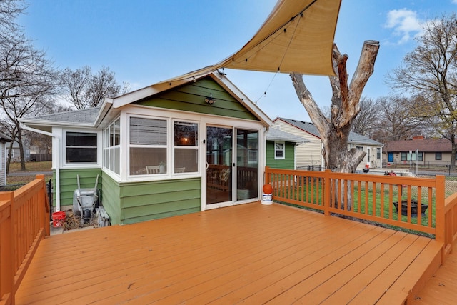 deck with a sunroom