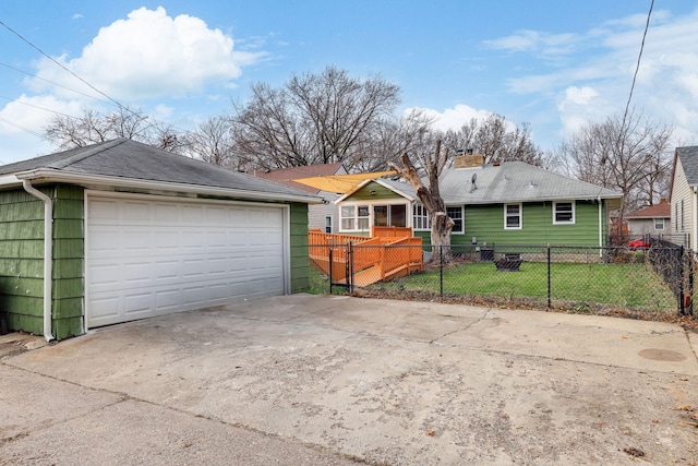 exterior space featuring a garage and a front lawn