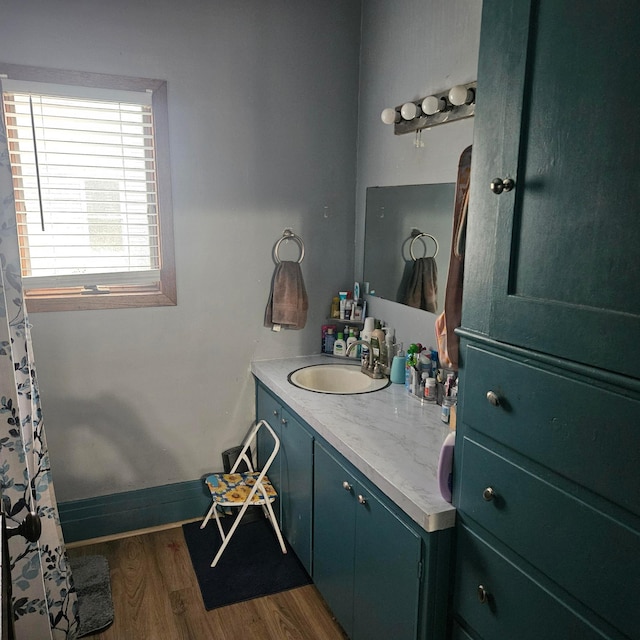 bathroom with vanity and hardwood / wood-style floors