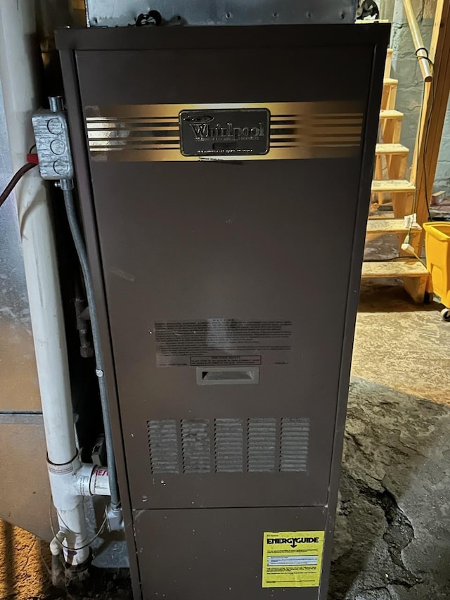 utility room featuring heating unit