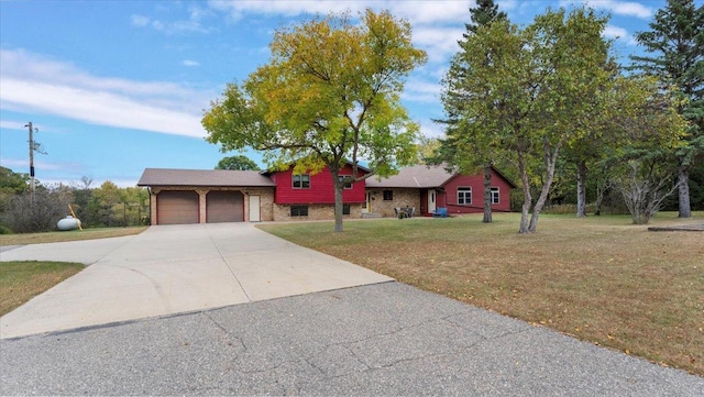 ranch-style house with a garage and a front lawn