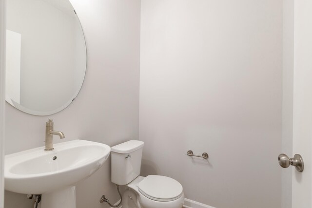 bathroom with sink and toilet