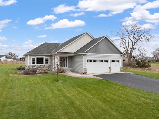 view of front of house featuring a garage, stone siding, a front lawn, and aphalt driveway