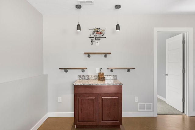 bathroom featuring visible vents and baseboards