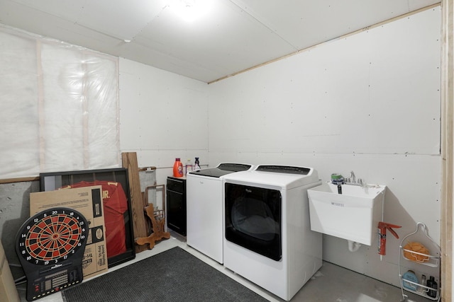 laundry room featuring a sink, laundry area, and washing machine and dryer