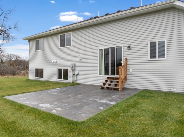 rear view of property with entry steps, a patio, and a lawn