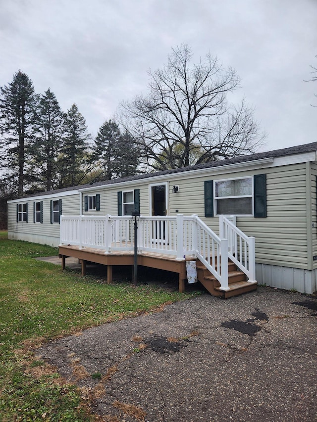 exterior space featuring a deck and a yard