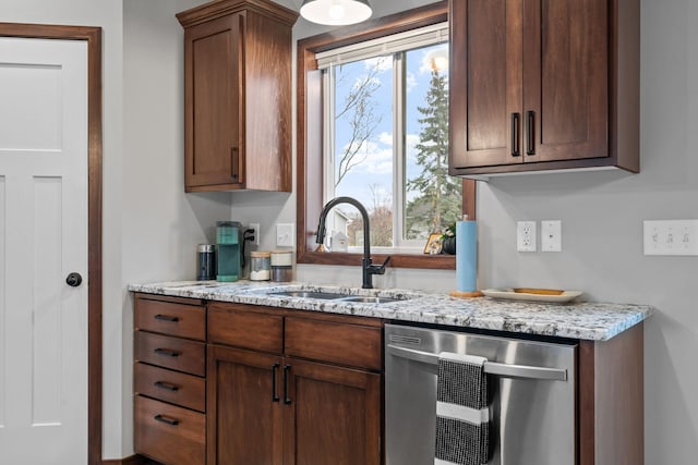 kitchen featuring a sink, light stone countertops, and stainless steel dishwasher