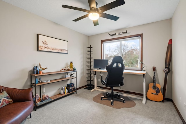 office area featuring baseboards, carpet floors, and ceiling fan