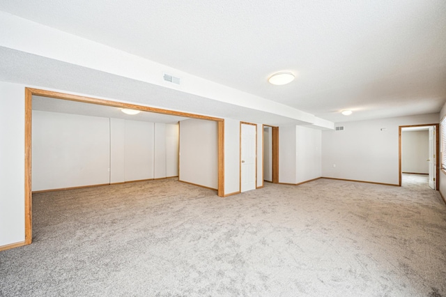 basement with light colored carpet