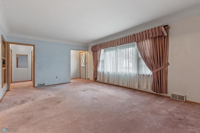 carpeted empty room with crown molding