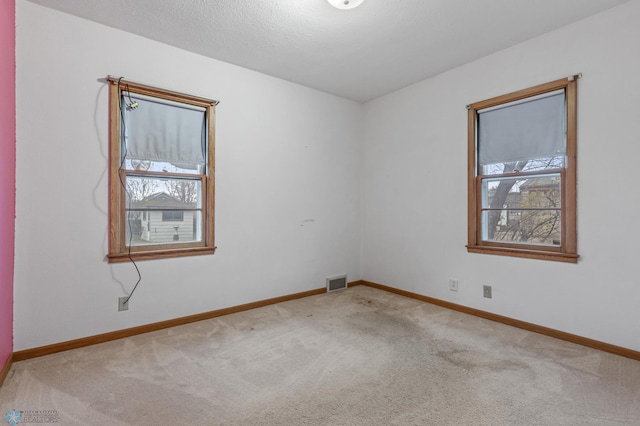 unfurnished room featuring carpet floors