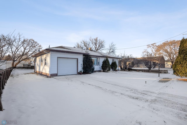 single story home featuring a garage