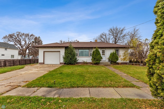 view of front facade with a front yard and a garage