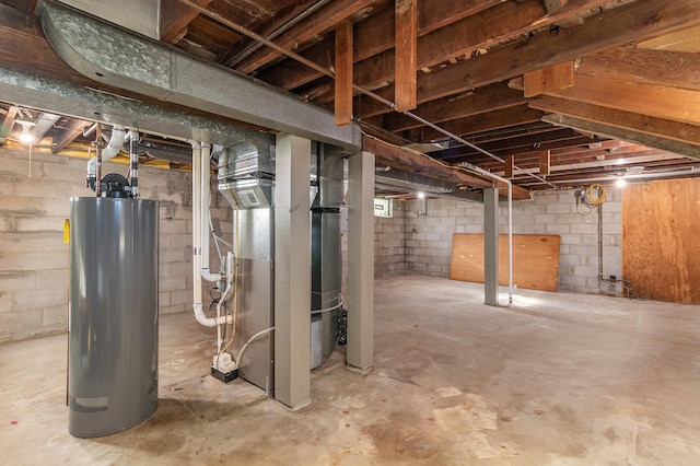 basement featuring heating unit and water heater