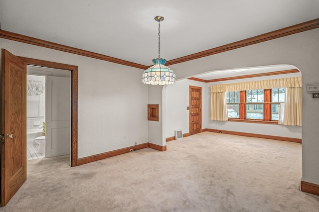 spare room with light carpet and ornamental molding