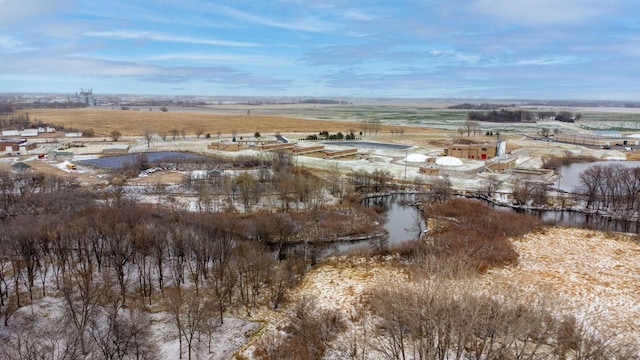 birds eye view of property with a rural view and a water view