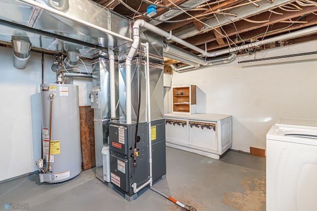 basement with heating unit, gas water heater, and independent washer and dryer