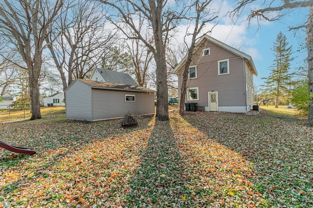 rear view of property with cooling unit