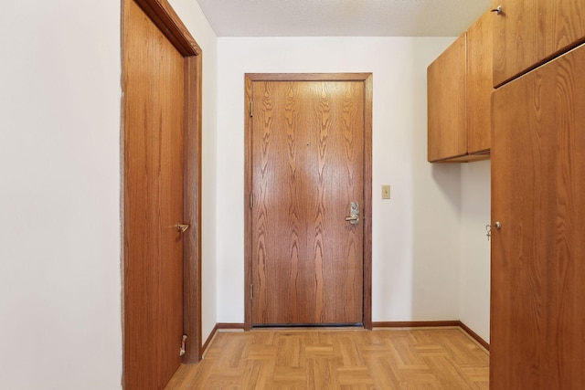 corridor with light parquet flooring