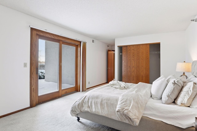 carpeted bedroom featuring access to exterior and a closet