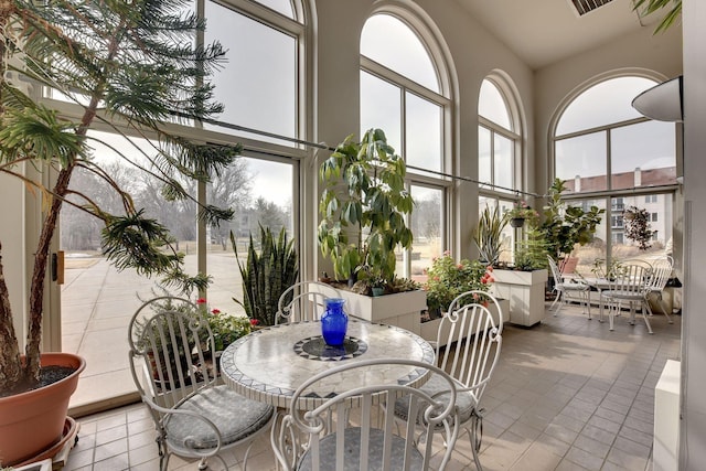 sunroom / solarium featuring a wealth of natural light