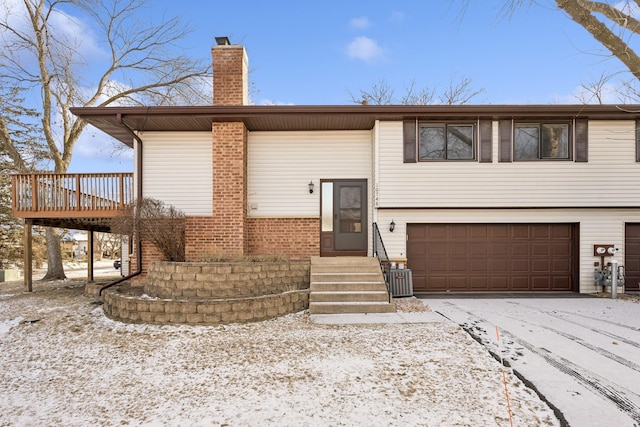 view of front of house featuring a garage and a deck