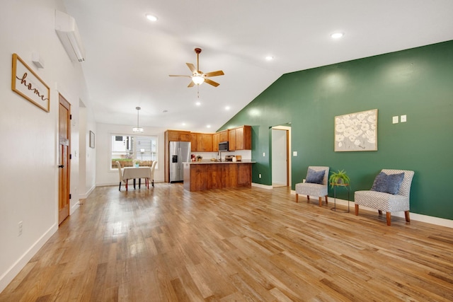 living room with light wood-type flooring, ceiling fan, high vaulted ceiling, and an AC wall unit