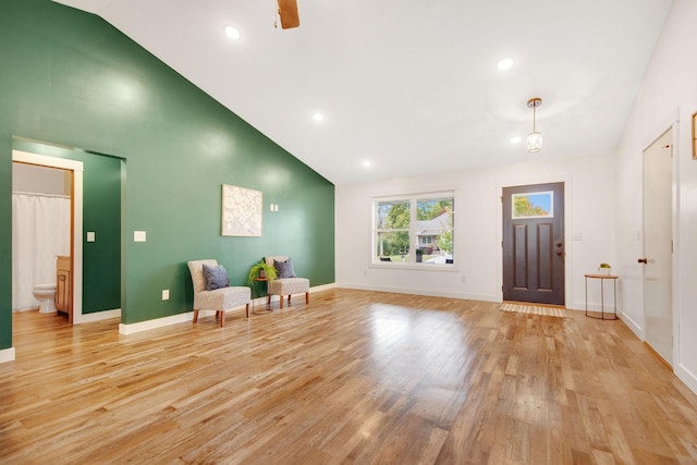 entryway featuring light hardwood / wood-style floors and high vaulted ceiling