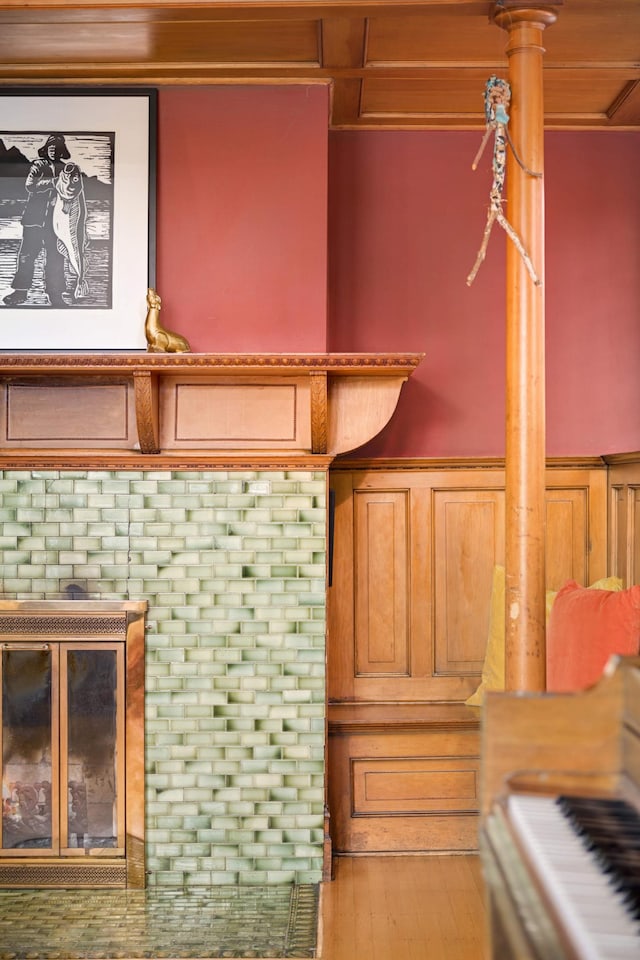 interior details with a brick fireplace and hardwood / wood-style floors