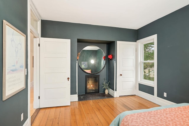 bedroom with hardwood / wood-style flooring