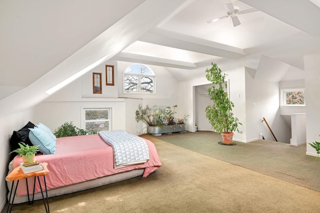 carpeted bedroom featuring ceiling fan and vaulted ceiling