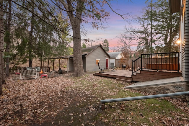 yard at dusk with a deck