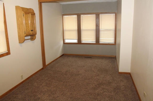 empty room with carpet flooring