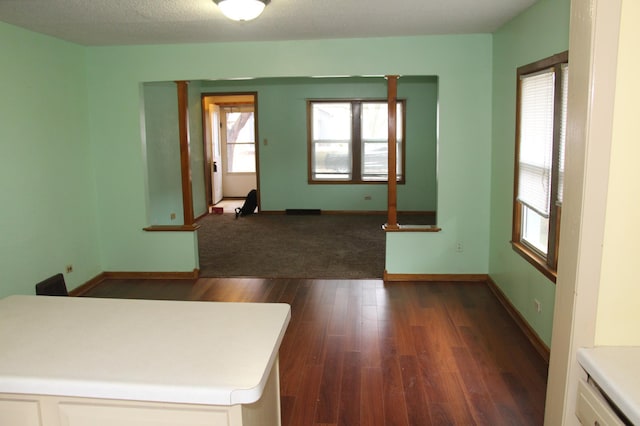 interior space featuring dark hardwood / wood-style floors and plenty of natural light