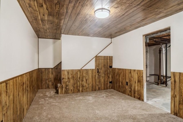 interior space with wood walls and wooden ceiling