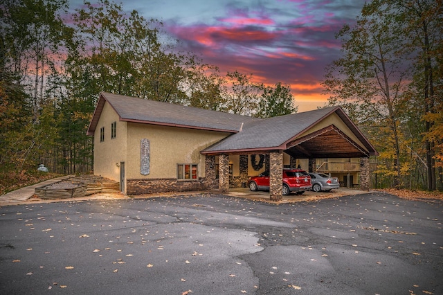 view of front of home featuring a carport