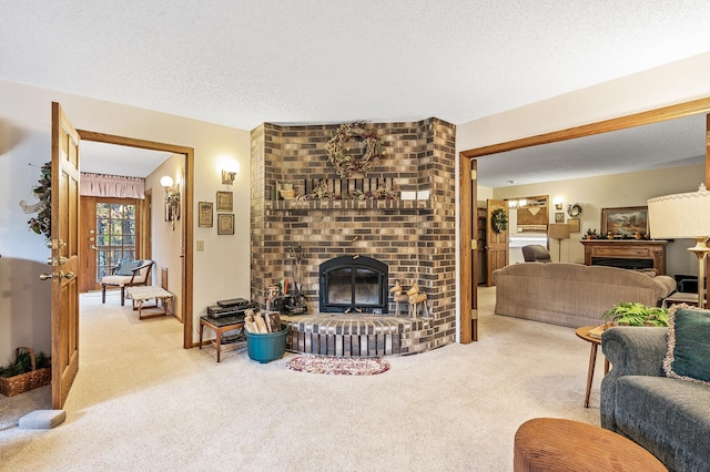 living room featuring a brick fireplace, a textured ceiling, and carpet flooring