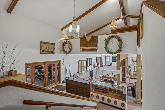 stairs with carpet flooring, french doors, a notable chandelier, high vaulted ceiling, and beam ceiling