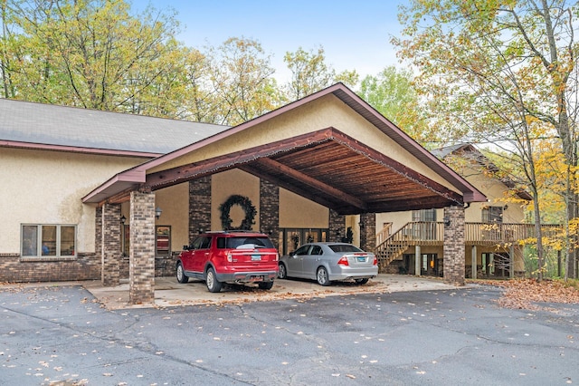 exterior space with a carport