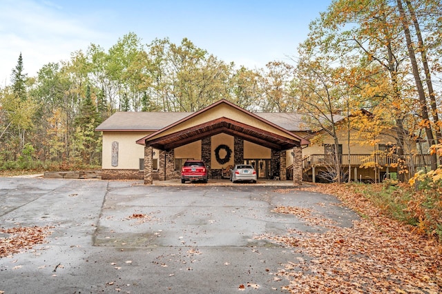 exterior space with a carport