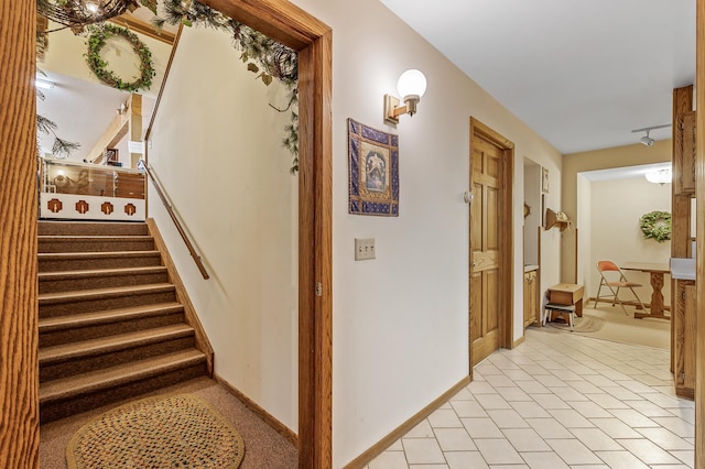 stairs with tile patterned floors