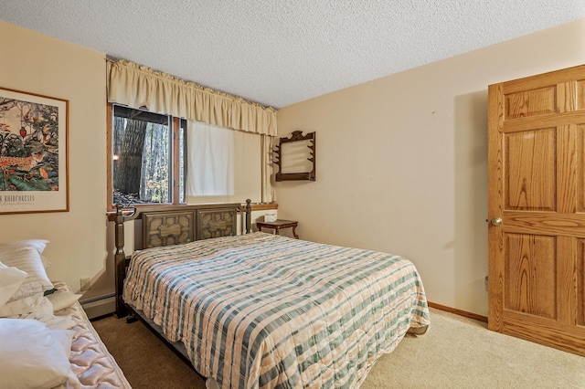 carpeted bedroom with a textured ceiling and baseboard heating