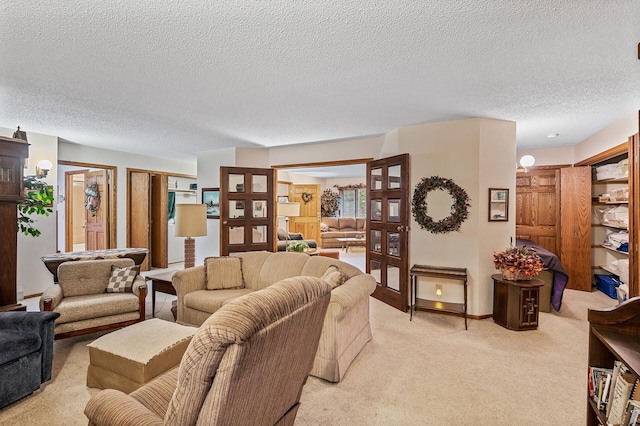 living room featuring light colored carpet and a textured ceiling