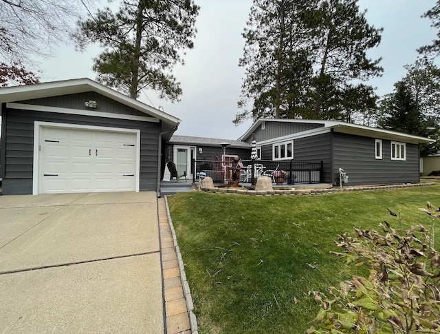 ranch-style home with a front lawn and a garage