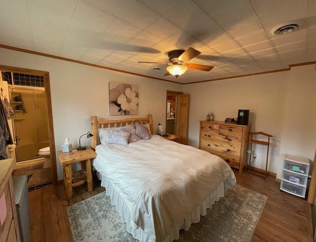 bedroom with ceiling fan, dark hardwood / wood-style flooring, and crown molding