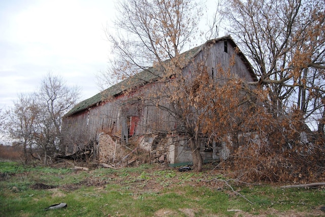 view of home's exterior featuring an outbuilding