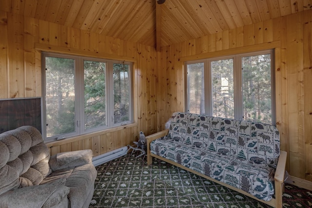 sunroom featuring a baseboard heating unit and wood ceiling