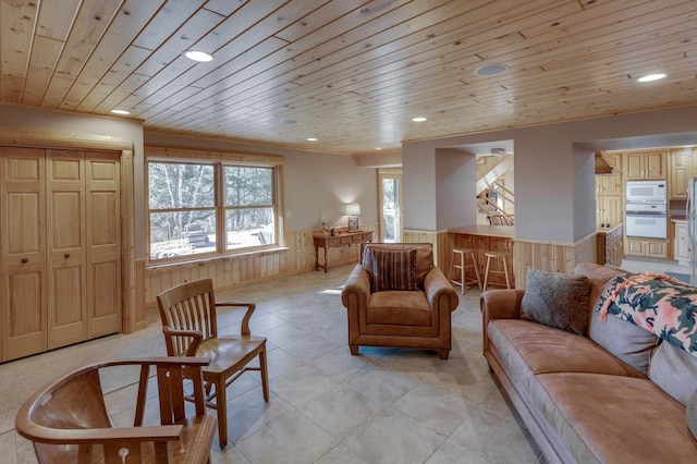 living room with wood walls and wooden ceiling